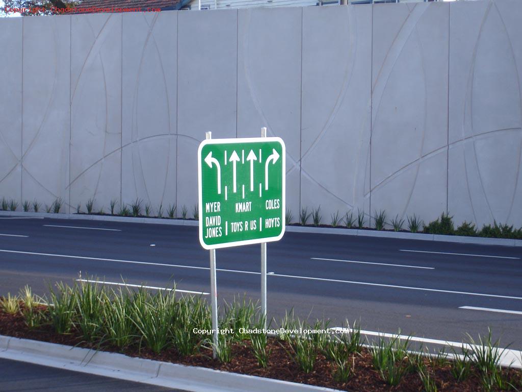Road signage with shop directions - Chadstone Development Discussions
