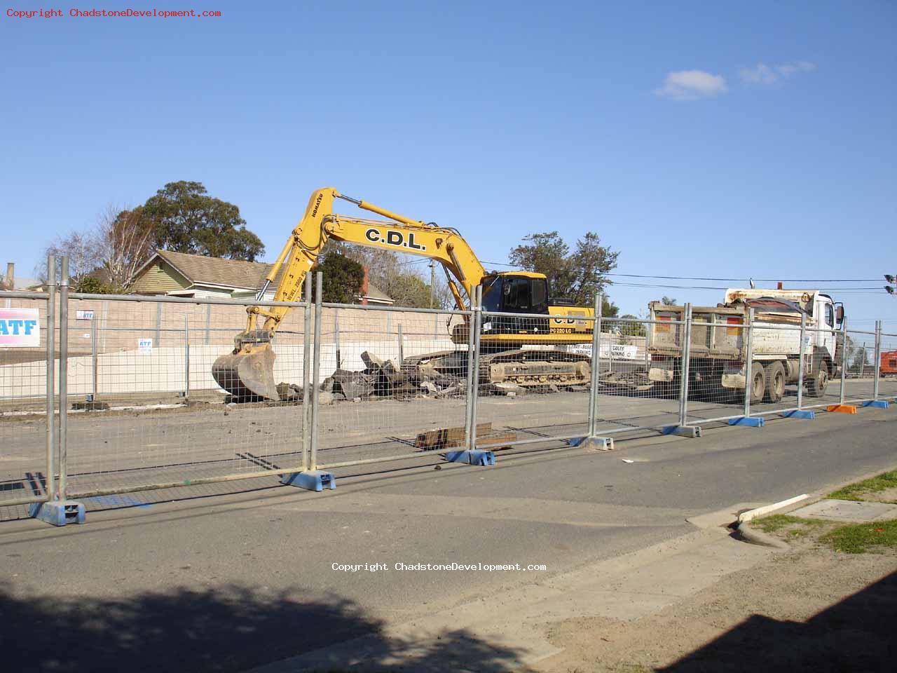 Digging up bitumen into haulage truck - Chadstone Development Discussions