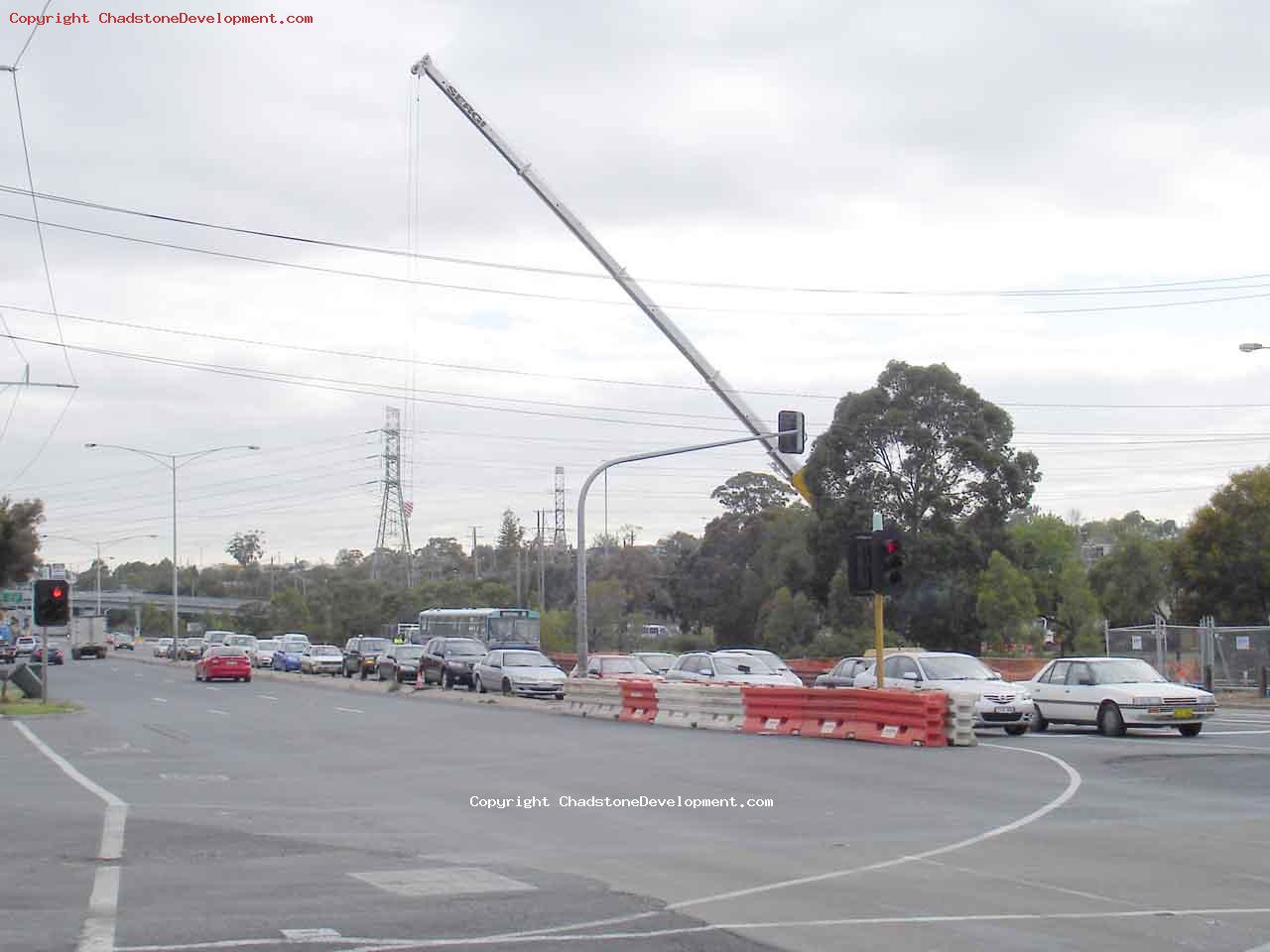 A crane lifts concrete on warrigal rd - Chadstone Development Discussions