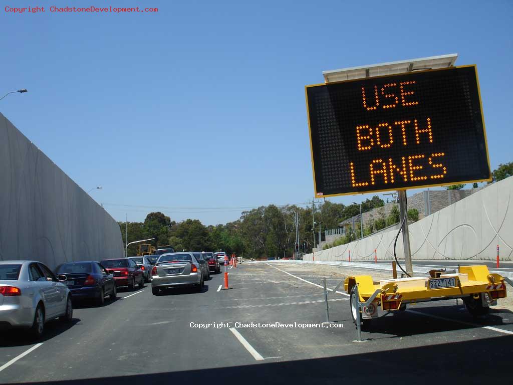 Sign telling motorists to 'Use Both Lanes' on Middle Road - Chadstone Development Discussions